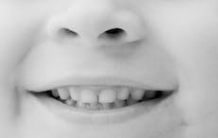 The mouth of a child who is almost old enough for the Tooth Fairy